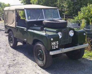 Front view of early series land Rover with hand painted number plate