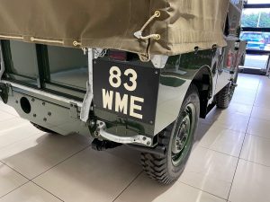 Early Land Rover with hand painted rear number plate