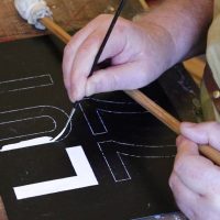 Mahlstick to support hand when signwriting